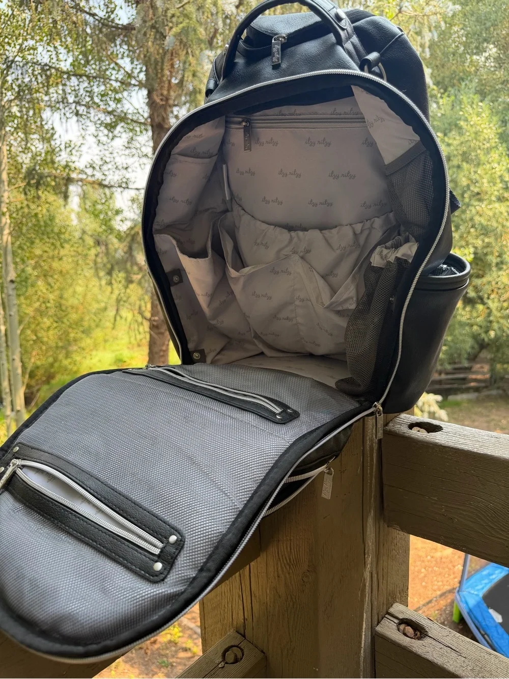 Itzy Ritzy Black Faux Leather Baby Backpack with Tassel Charm